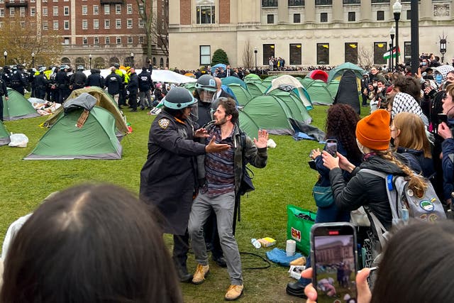 <p>Officers arrest a protestor who participated in an demonstration at the Columbia University campus</p>