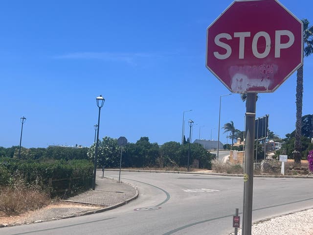 <p>A stop sign at the entrance to Praia Da Luz, faded graffiti declares: “STOP McCann circus.”</p>