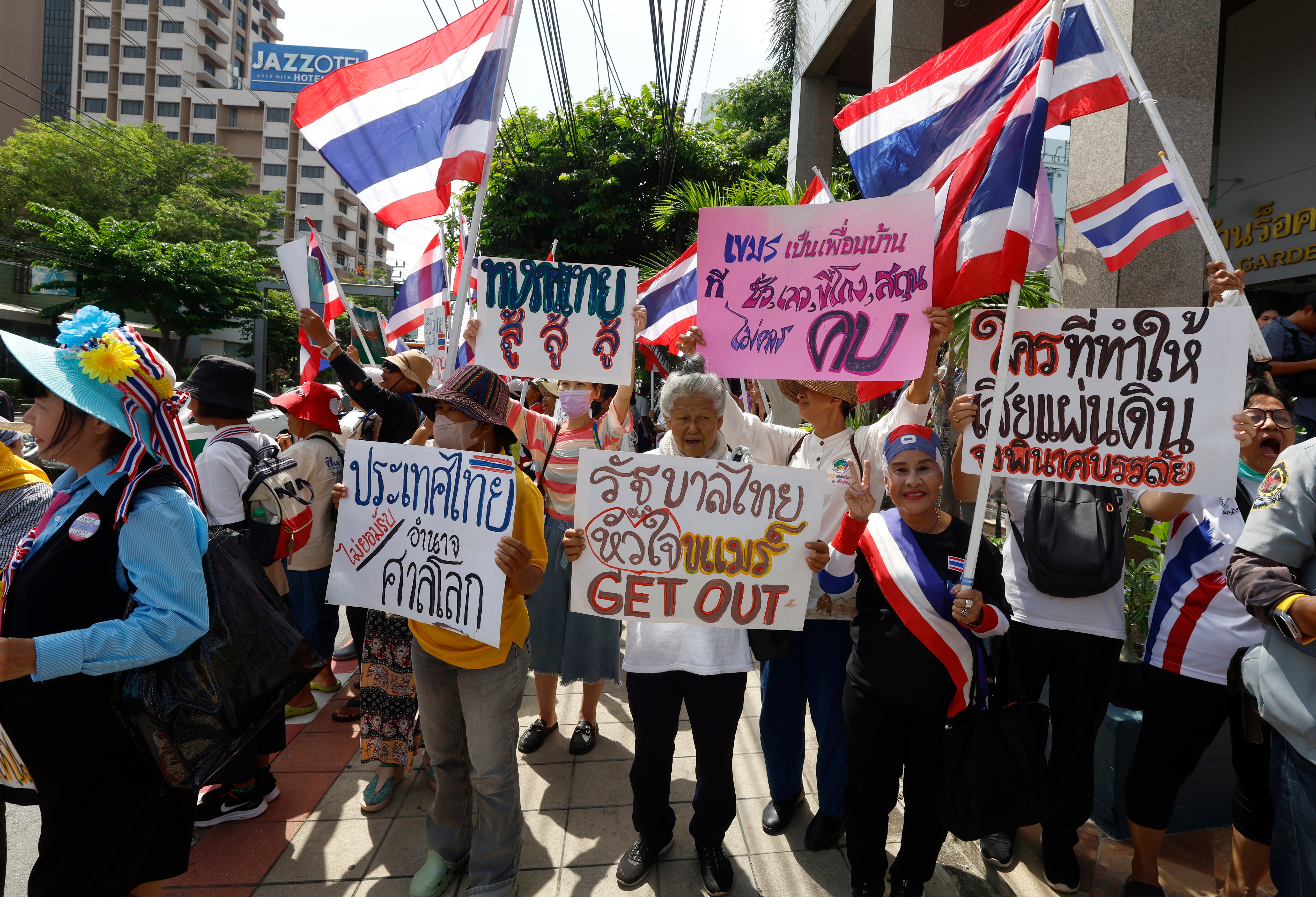 Thai nationalists hold national flags as they gather outside the Cambodian Embassy to protest over the Thai-Cambodian border dispute, in Bangkok, Thailand, 6 June 2025